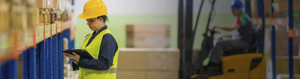 construction employee writing some note